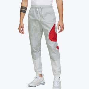 Pantalón Nike de nailon gris y forro de malla con logotipo Swoosh en la pierna para hombre